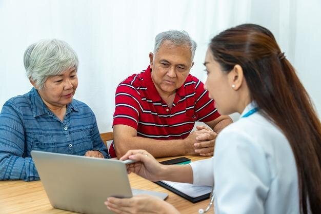 Doctor explaining Medicare to senior couple